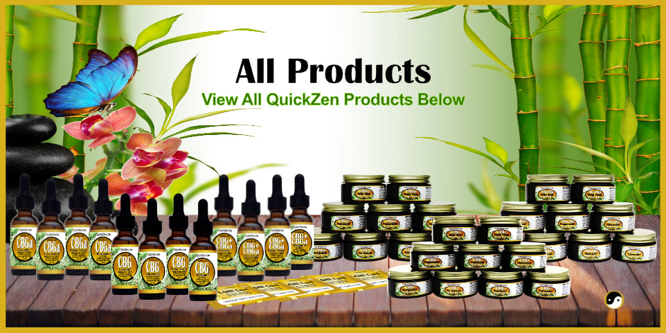 All QuickZen oil and salve products. Displayed on a wooden table with a butterfly resting on orchids.
